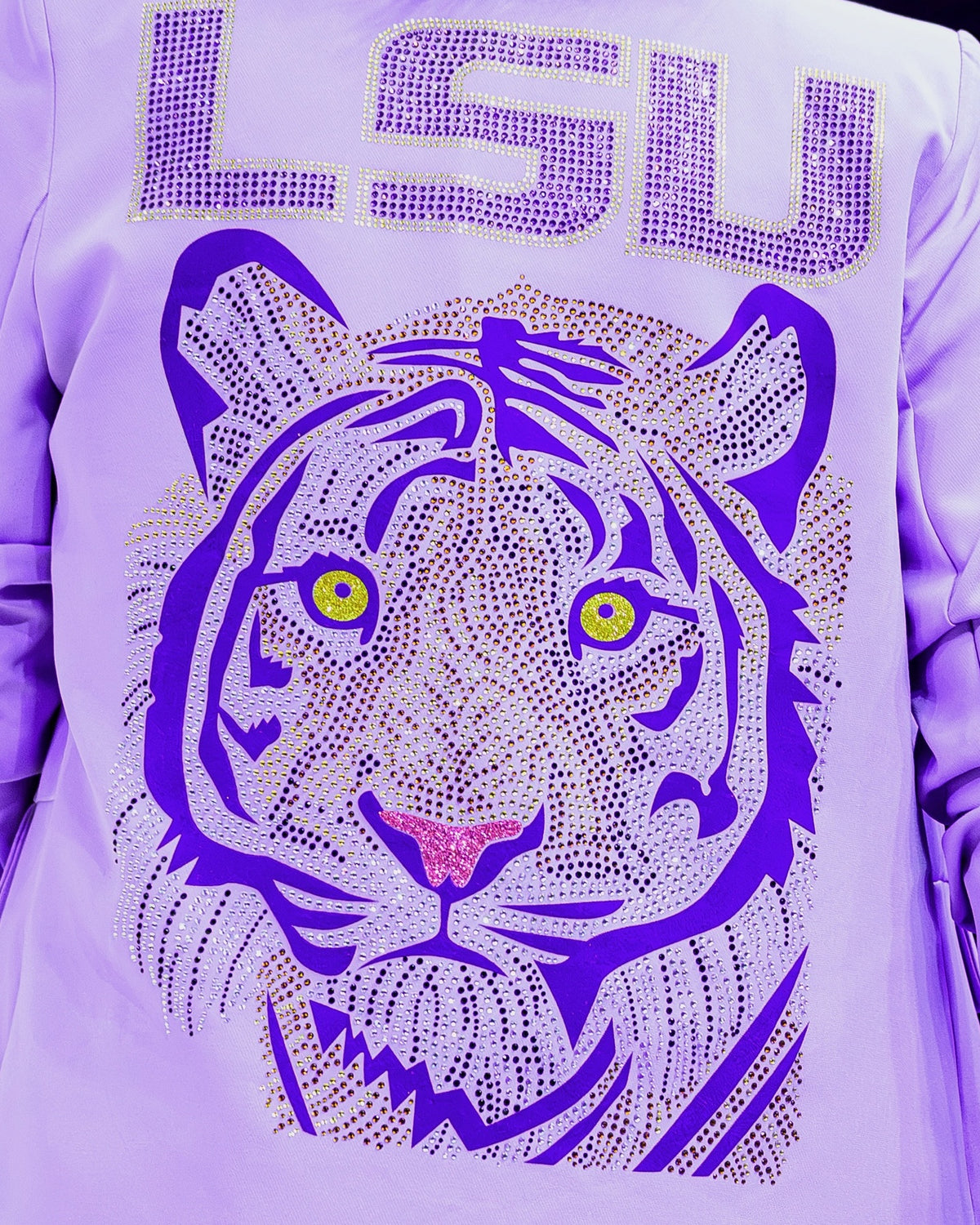Close-up of the rhinestone purple tiger on the lavender LSU blazer worn by Coach Kim Mulkey